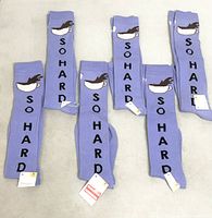 Six tagged pairs socks laid out showing SO HARD side