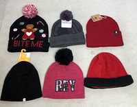 All six beanies laid out