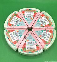 Six Beloved Watermelon & Mint Mojito bath bombs arranged in circle, labels visible