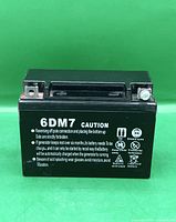 Front view displaying 6DM7 model and caution text