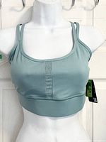 Front view of sage green Athletic Works sports bra on mannequin