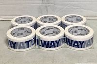 Front view of six shrink-wrapped Toolway Bond tape rolls