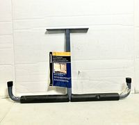Full view of Stinson overhead storage hook with tag