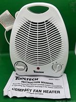 Front view of Tooltech model 100071 compact fan heater with manual