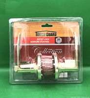 Front of sealed package showing Tough Guard polished brass lever entry lockset