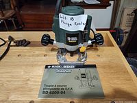 Router front view on workbench with manual visible