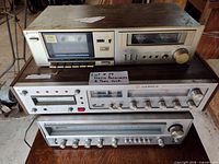 Front view of all three stacked components showing Candle and Sanyo branding and cassette deck controls