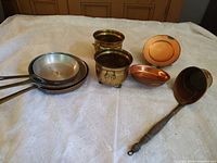 Group shot showing all seven metal pieces