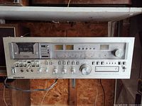 Front view showing cassette deck, tuner scale, controls and 8-track slot