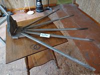 Rack shown fully extended with five arms splayed on tabletop