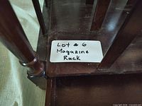 angled close-up showing lot label on magazine rack corner
