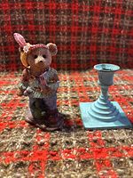 Front view of bear figurine and candle holder side by side