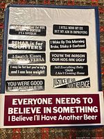 Front view showing all 10 small stickers on sheet and large bumper sticker