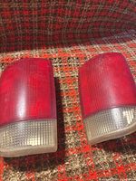 Both tail lights front view on plaid surface