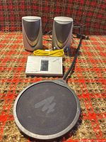 Full lot view with tuner, two Sony speakers, pop filter, yellow Ethernet cable