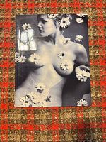Front view of the black and white nude art print with daisy motifs