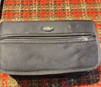 Front of black disc wallet with oval logo