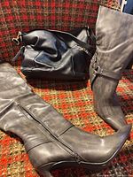 Black leather bag and gray boots overview