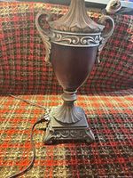 Full lamp base showing urn shape, handles and pedestal