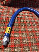 Full view of blue gas hose showing length and one fitting