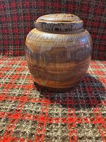 Front view of resin tree root textured sculpture with lid