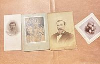 Four mounted portraits laid out side-by-side