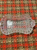 Top view of cut glass relish dish showing pattern and rim