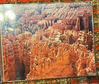 Front view of first framed photograph showing intricate red rock canyon formations