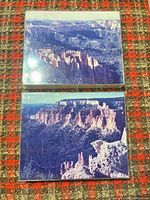 Both framed photographs showing canyon landscapes