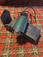 Flash unit, sensor module, wiring and battery pack on plaid surface