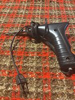 Full view of soldering gun showing handle, tip and cord