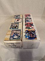 Two white long boxes with 1992 Score hockey cards taped on lids