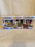 Front view of all three boxed Funko Pop! figures