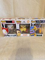Front view of all three boxed Funko Pop! figures