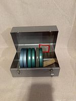 box open displaying six reels inside