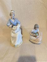 Front view of both porcelain figurines