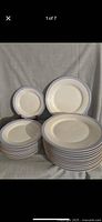 Stacked dinner and salad plates showing quantity and rim design