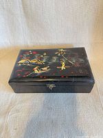 Closed box showing painted Chinoiserie scene and latch