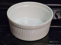 Angled view of ramekin showing fluted exterior