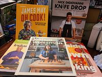 Group shot of all five cookbooks stacked and standing