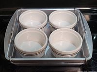 full set showing pan, rack, four ramekins