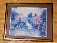 Full view of framed print on floor showing artwork, mats and frame