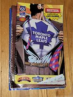 Stack of three Toronto Maple Leafs calendars, top comic-style cover visible