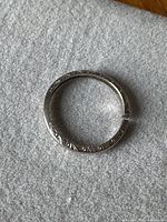 Overview of full ring showing engraved pattern and break