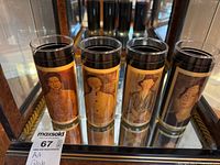 All four portrait art tumblers on shelf