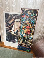 Front view of both prints leaning against wall