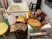 Group shot showing wall clock, plaques, figurines, lampshade, level and gauge