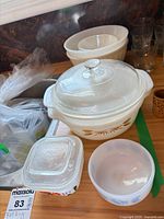 Group view with wheat pattern casserole, square lid, swirl bowl and small bowl