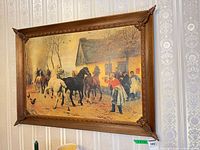 Overall view of framed equestrian print on wall