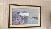 Full view of framed Claude Monet print on wall